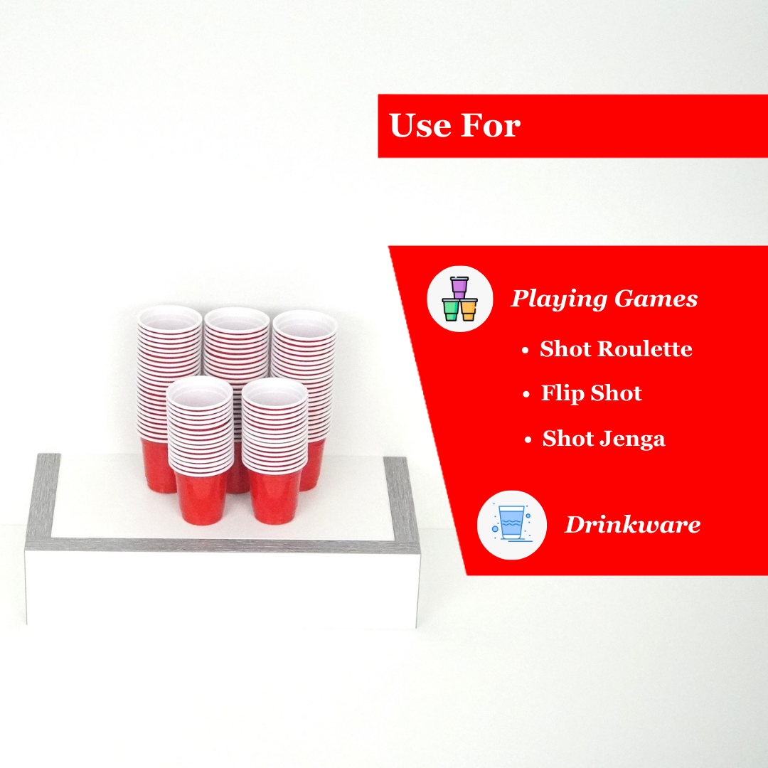 Pack of 100 red plastic shot cups, 2 oz capacity, ideal for games and drinkware at parties