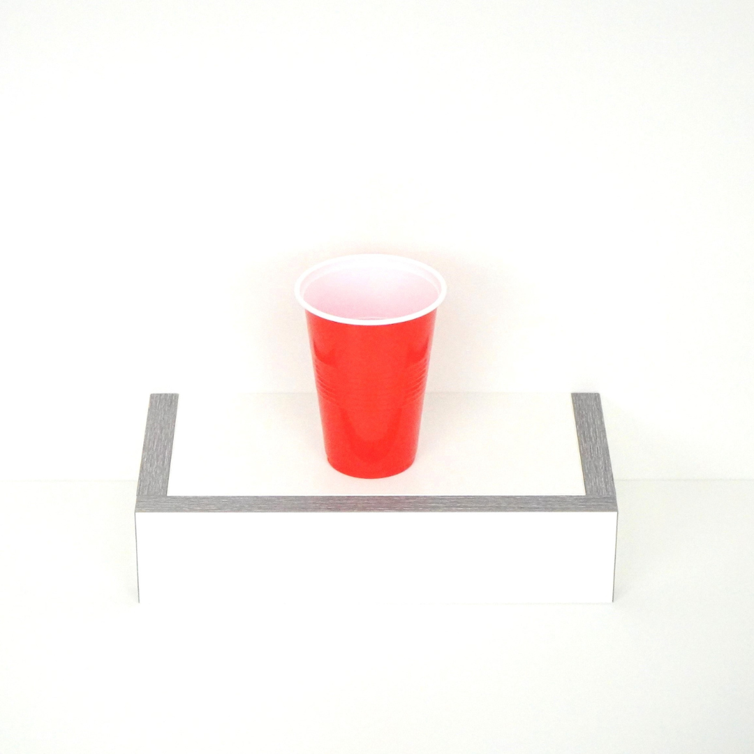 Single red beer pong cup, 16 oz capacity, faced up, showcasing the top design