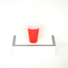 Single red beer pong cup, 16 oz capacity, faced up, showcasing the top design