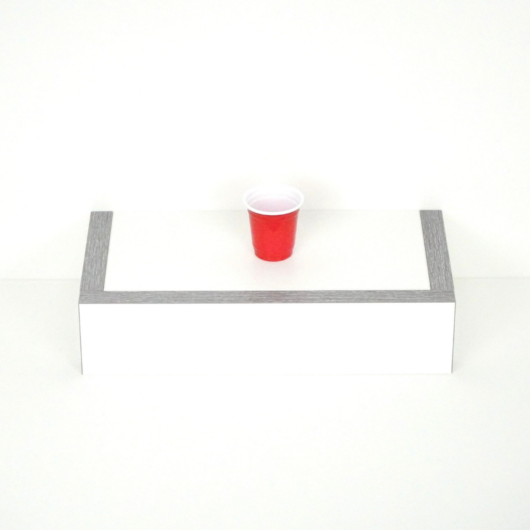 Single red 2 oz shot cup viewed from above, showcasing top design and shape