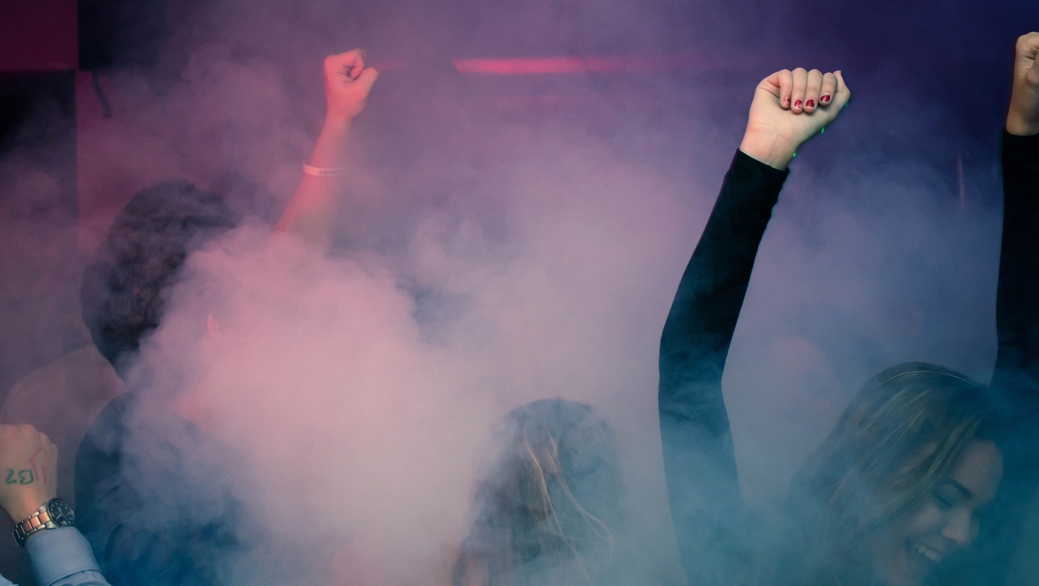 Exciting Party: People Dancing with Smoke and Red & Blue LED Lights, Girl Enjoying in Front